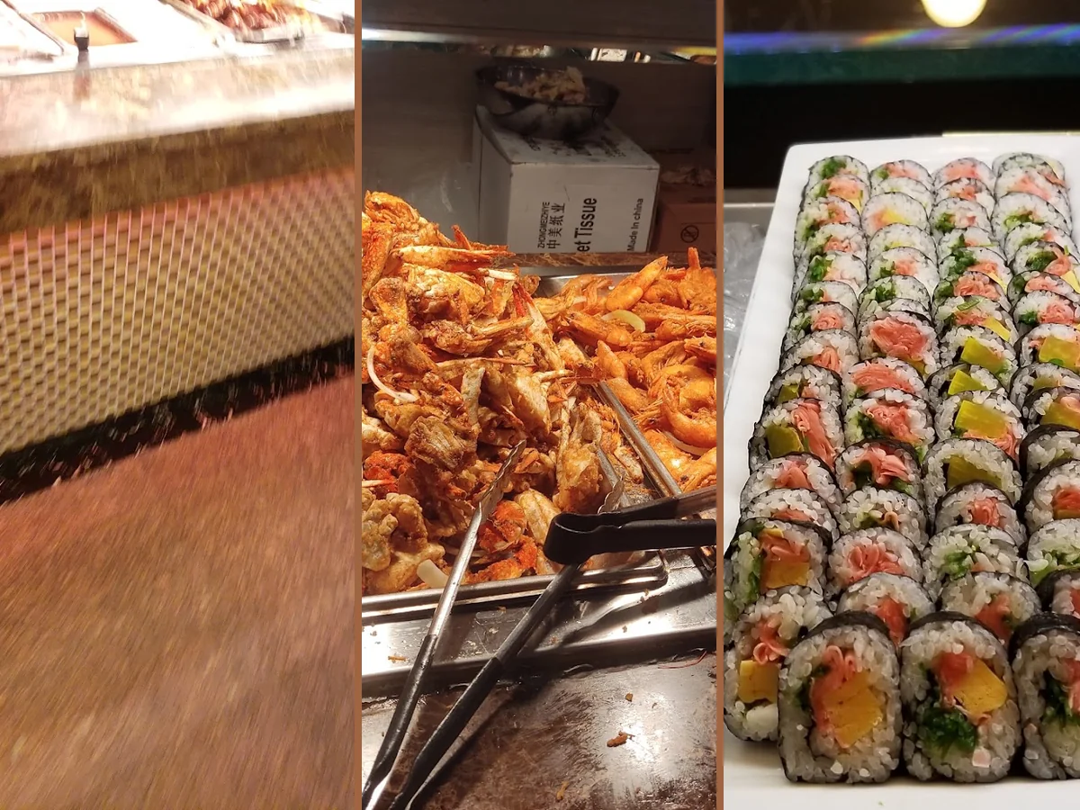 Buffet trays filled with Chinese dishes and seafood.