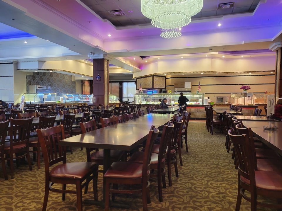 Bright buffet dining room with long serving stations.