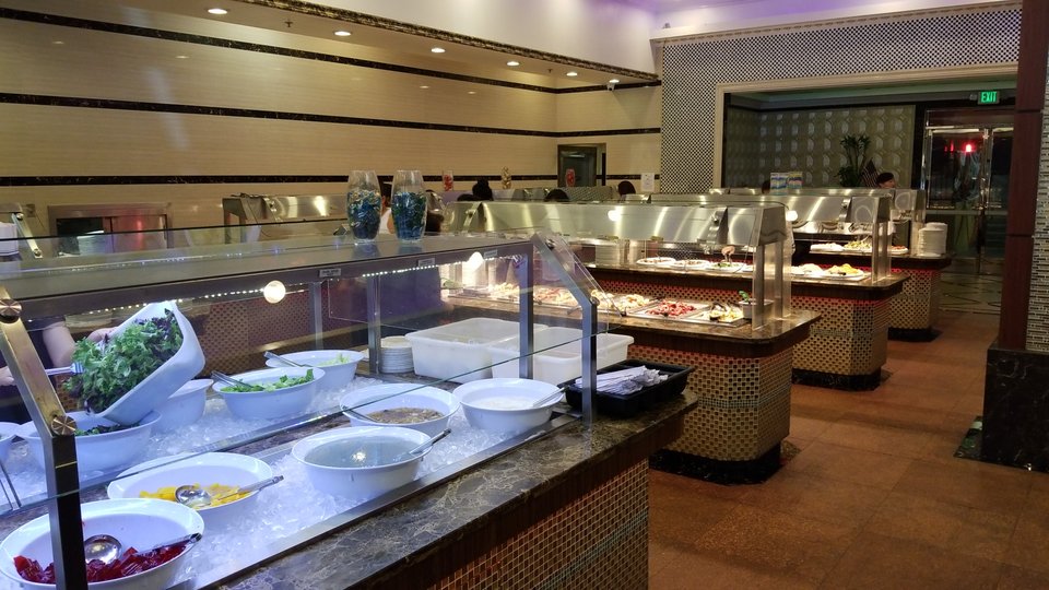 Wide dining room with seating for buffet service.