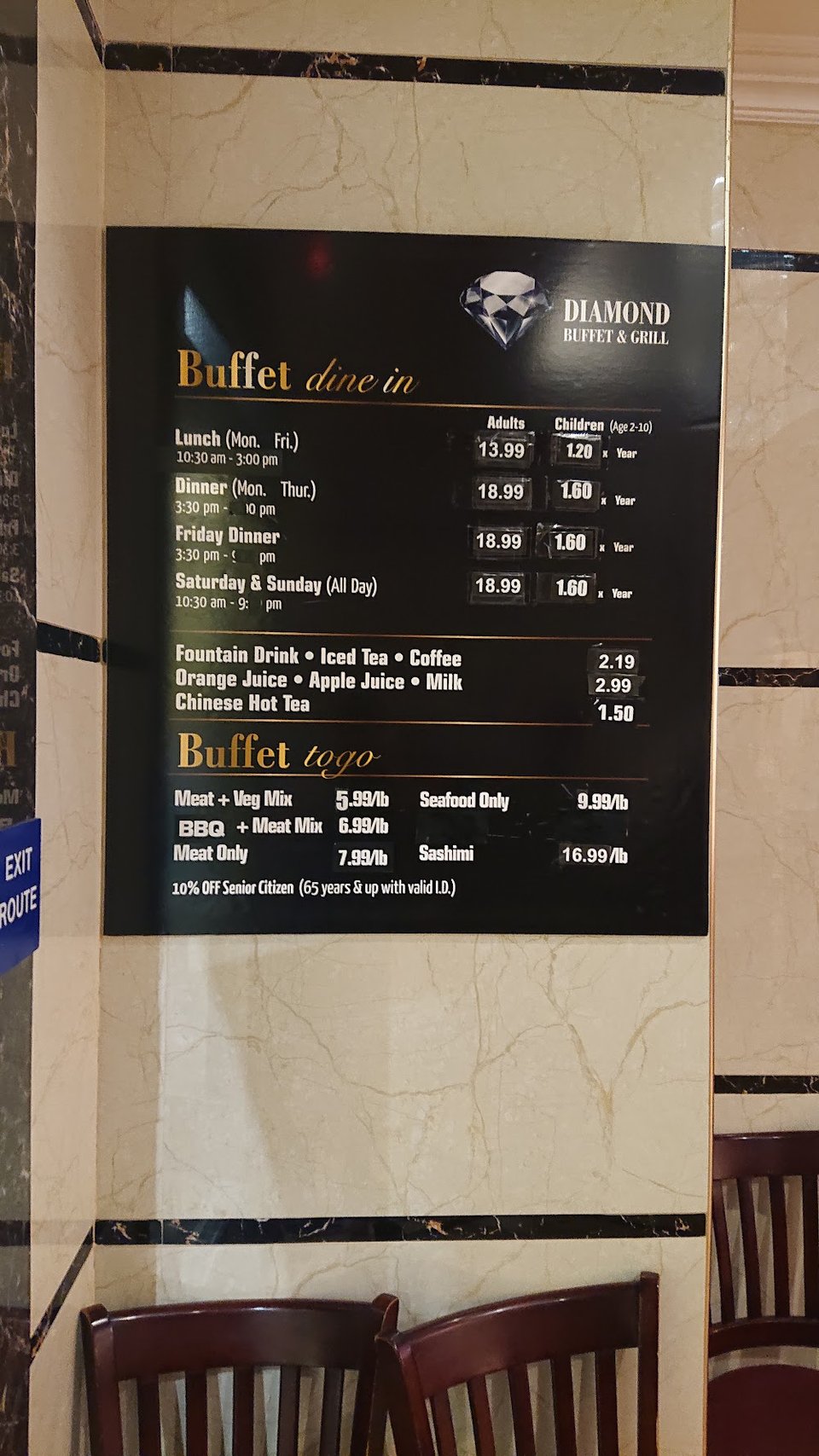 Seafood dishes displayed beside hot Chinese entrées.